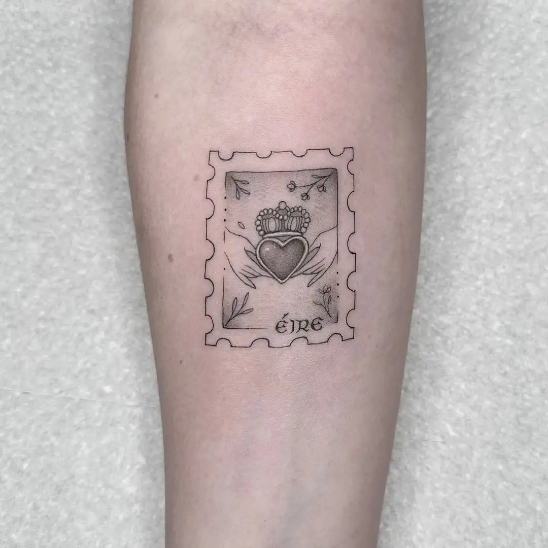 Fine line Éire Claddagh stamp tattoo at XOXO Dublin