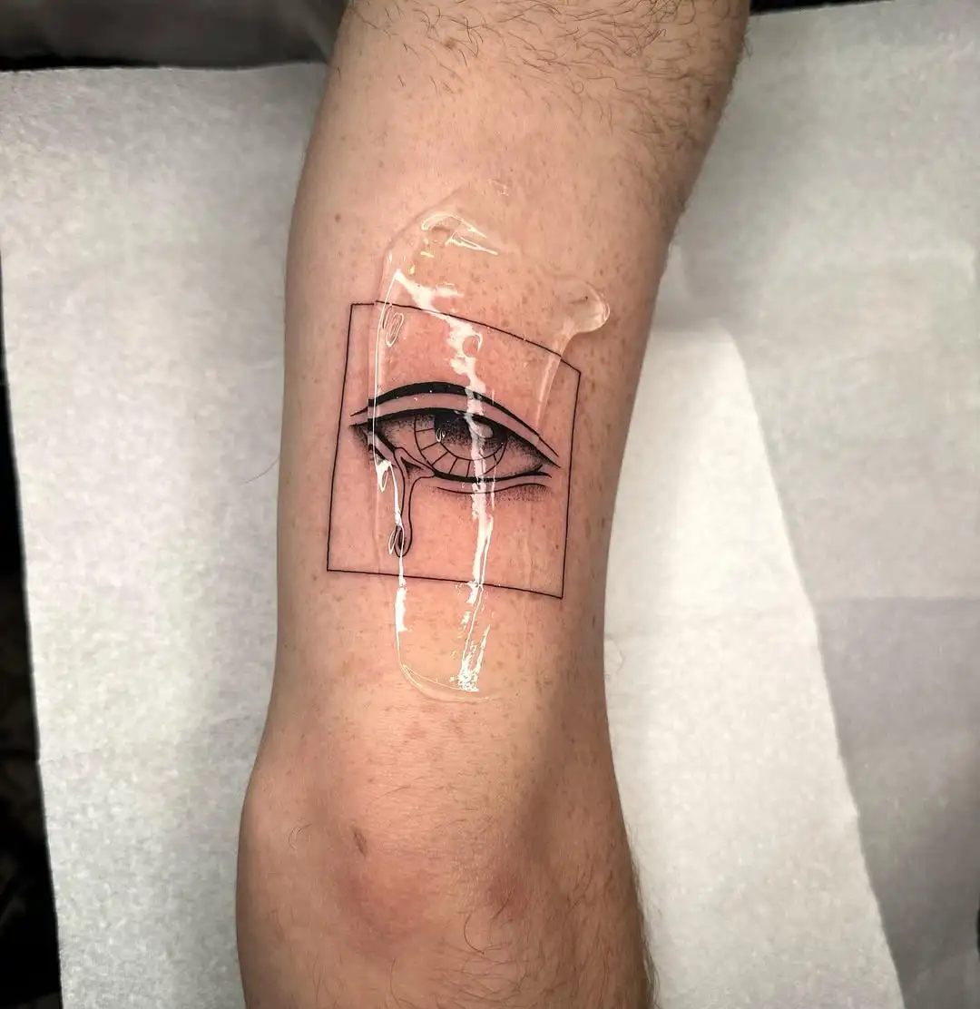 Fine line eye tattoo in geometric frame at XOXO Dublin