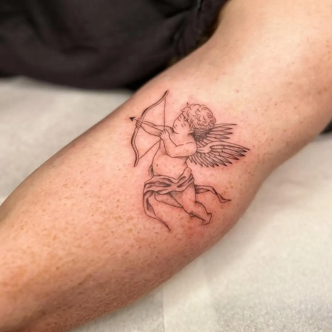 Fine line cherub with bow and arrow tattoo at XOXO Dublin