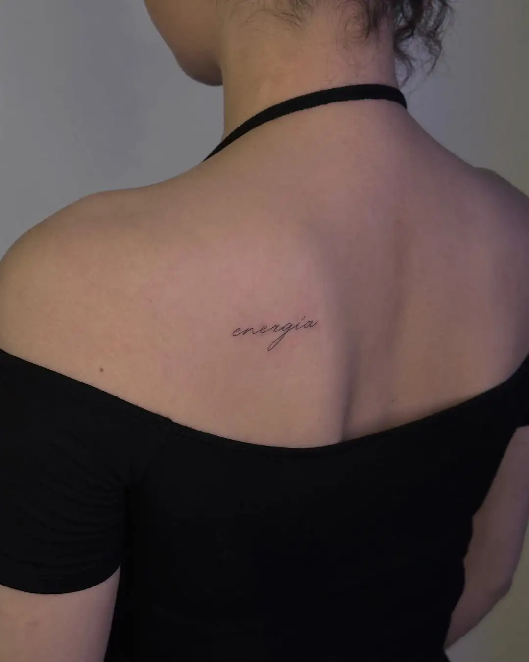 Fine line energía script lettering tattoo at XOXO Dublin