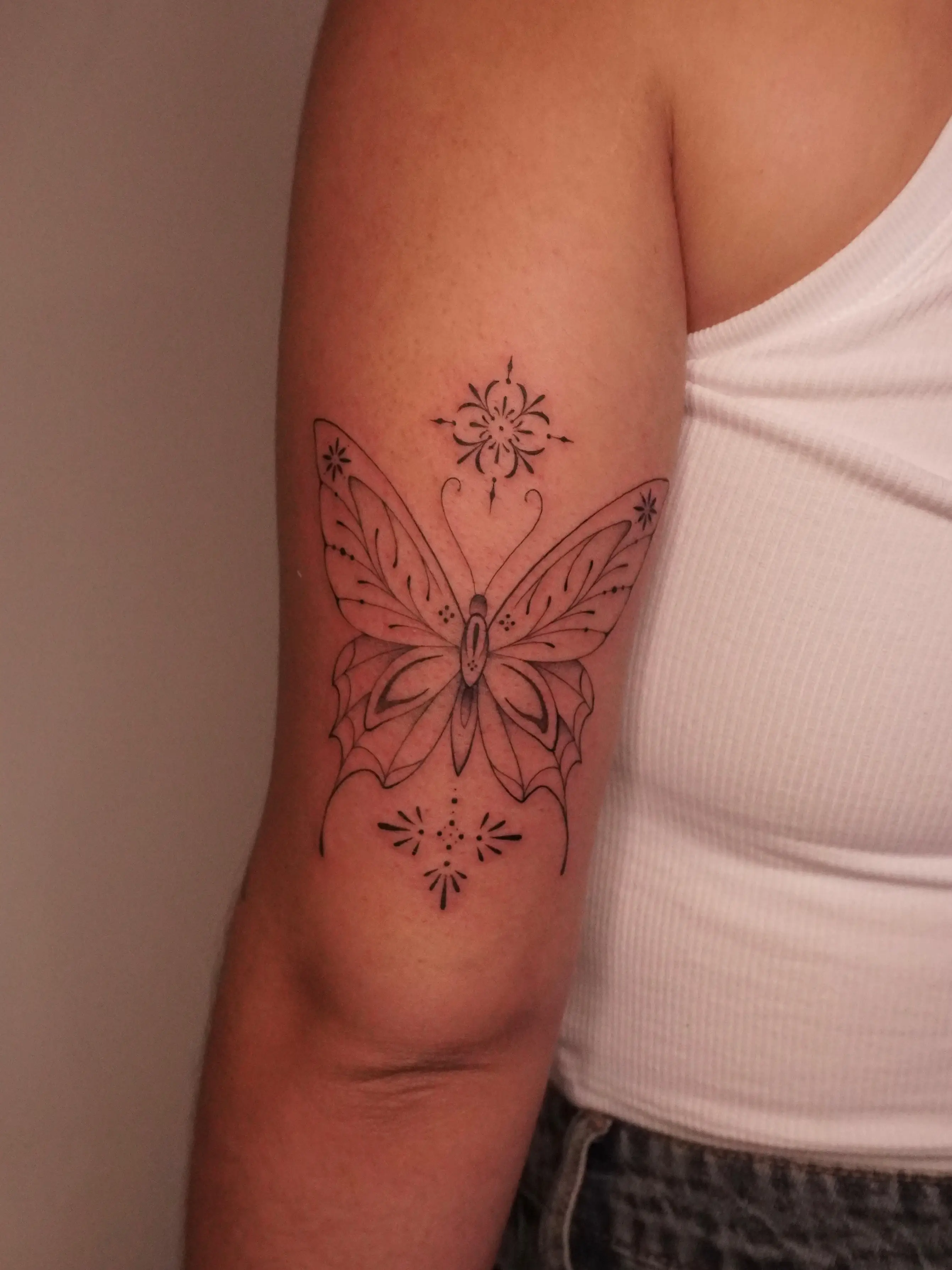 Ornate mandala butterfly tattoo by Christine Bevilaqua at XOXO Tattoo Dublin