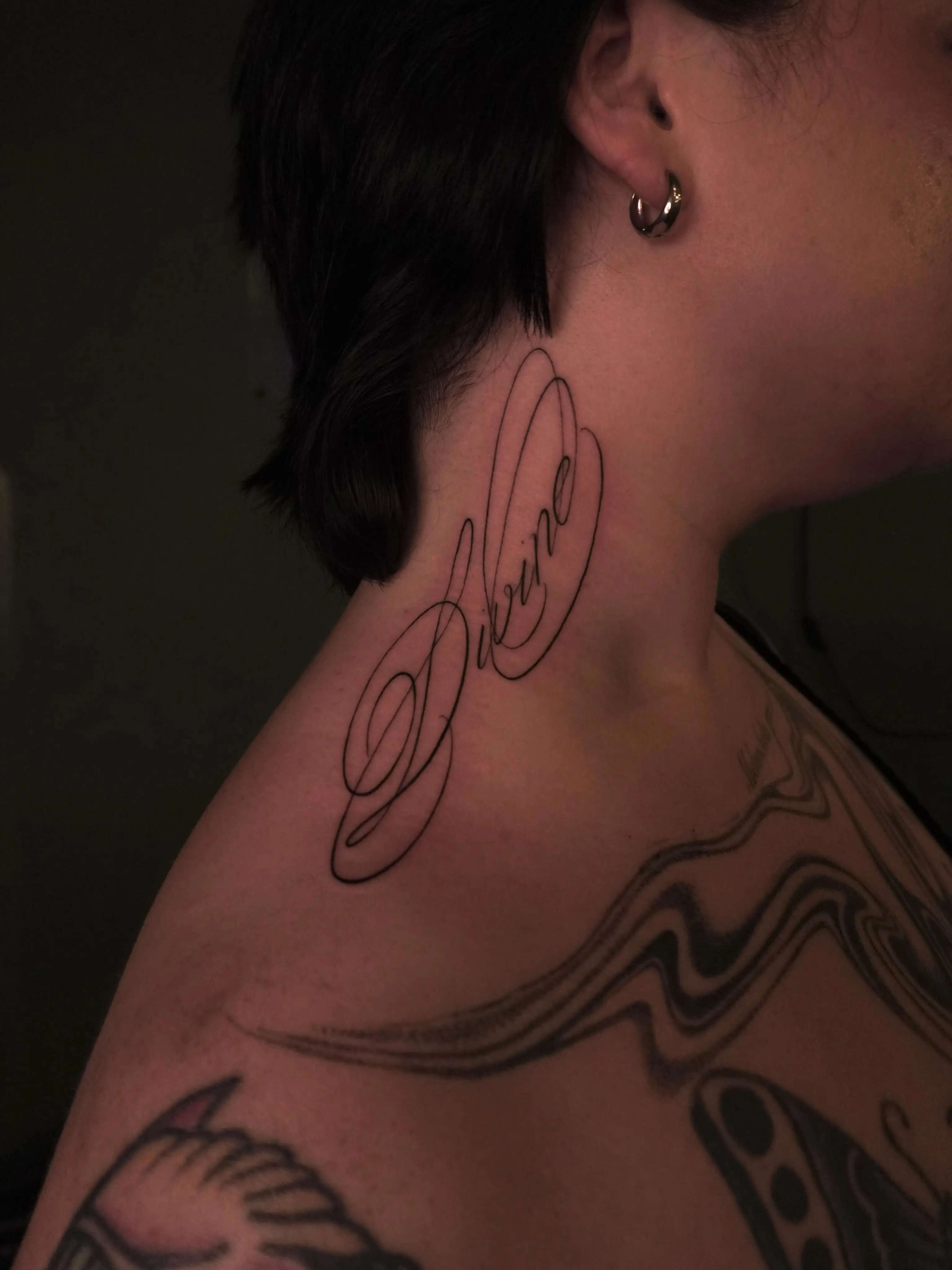 Script lettering neck tattoo by Christine Bevilaqua, XOXO Dublin