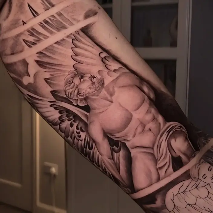 Black and grey angel statue sleeve tattoo by Paulo Rodrigues, XOXO Dublin
