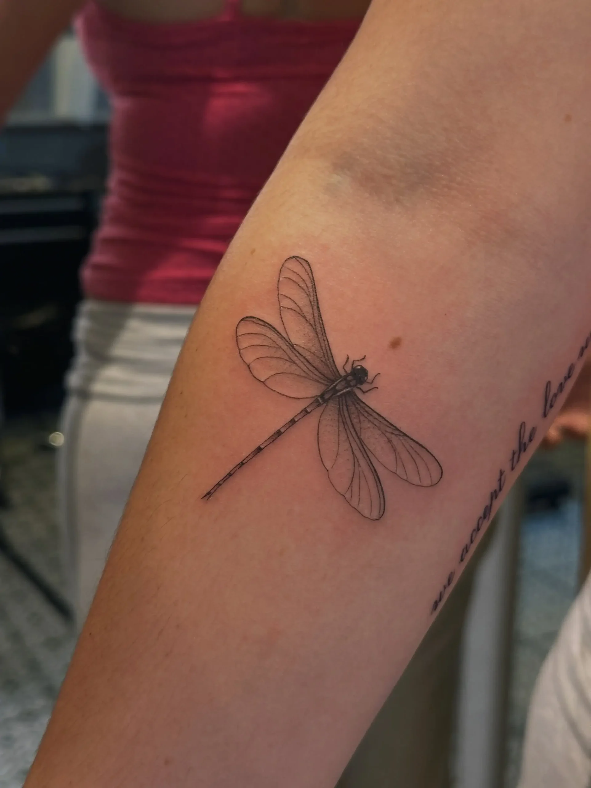 Fine-line dragonfly forearm tattoo by Paulo Rodrigues, XOXO Tattoo Dublin
